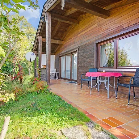 Шале Quaint Chalet With Garden Terrace Fireplace Play Equipment